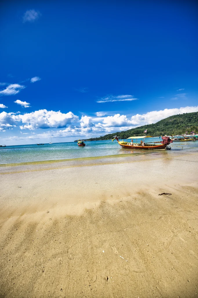 Tropical Beaches of Thailand with Clear Waters and Limestone Cliffs