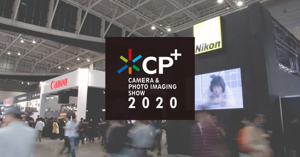 Crowded showroom at CP+ 2025 with photographers testing camera gear