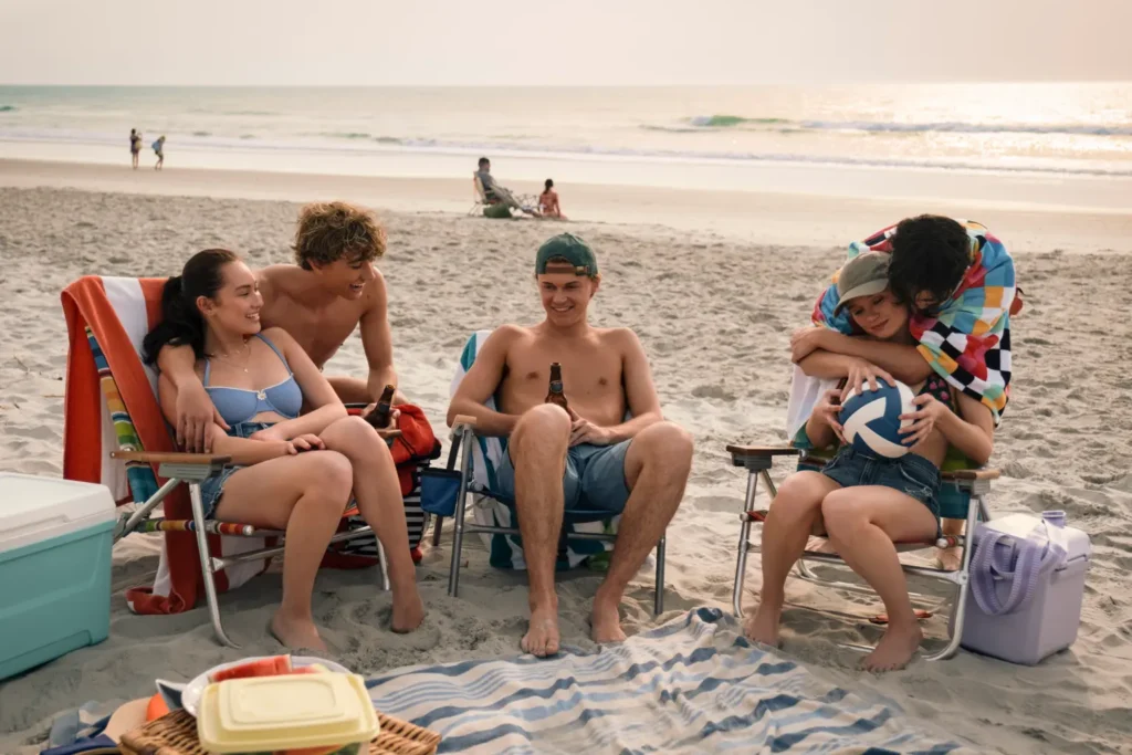 Belly and friends during an emotional beach sunset in Season Finale