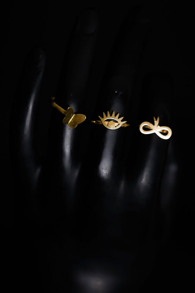 elegant gold bracelets displayed on black background — luxury jewelry photography by Dicaplo Studio Dubai