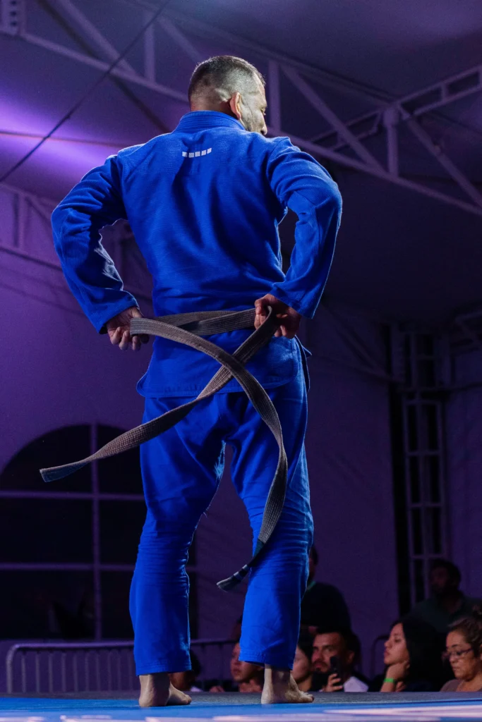 Professional Jiu Jitsu athlete preparing for competition in Abu Dhabi arena captured with cinematic sports photography by Dicaplo Media.
