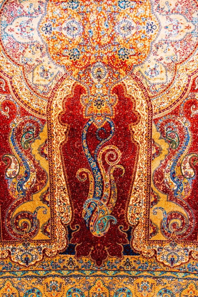 Professional videography of a luxury carpet showroom in Dubai featuring premium Persian and modern rugs.